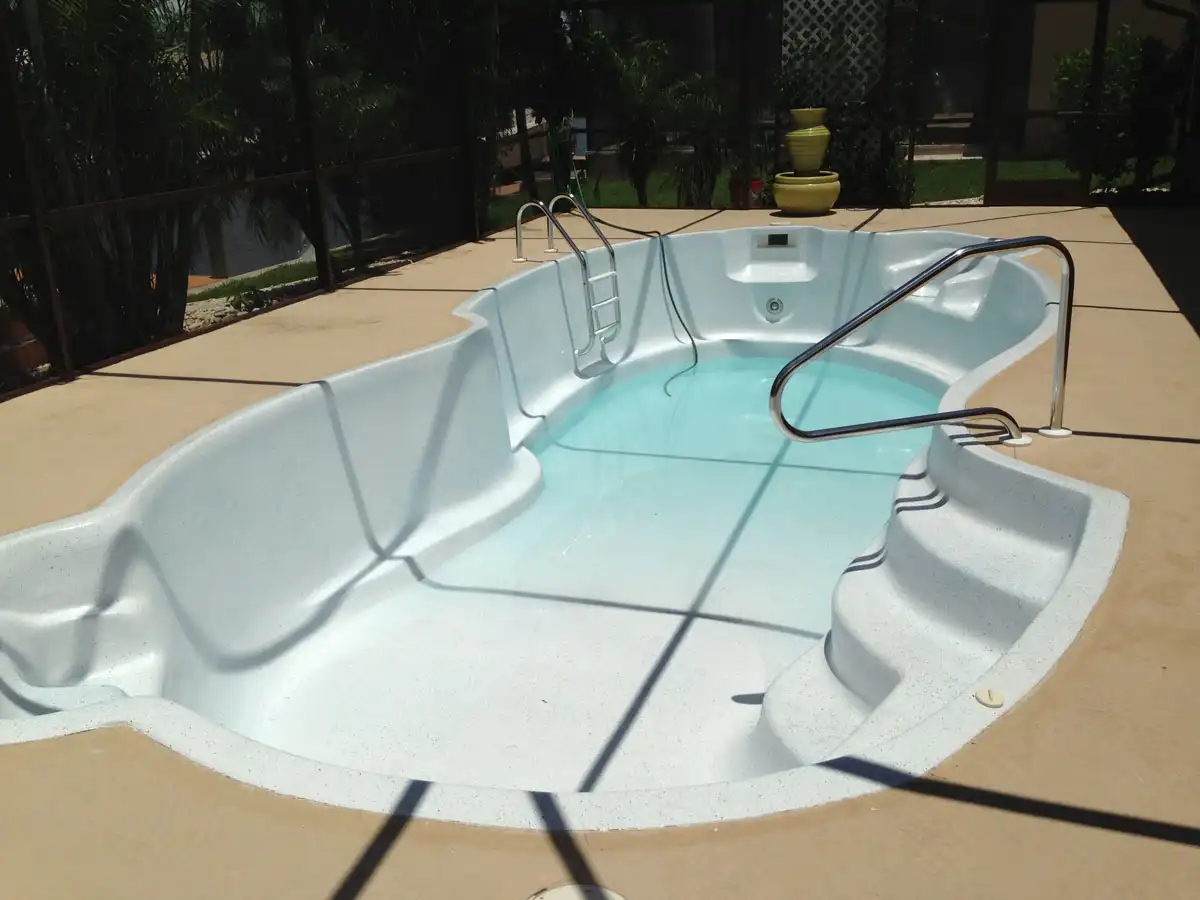 Backyard fiberglass pool after refinishing